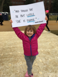 Annie's daughter Evie proudly holds her sign at the Women's March on Washington.