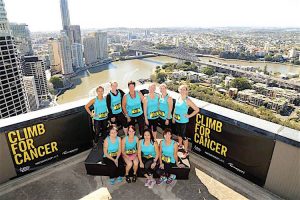 Sue Beith (# 528) celebrates after climbing 37 flights of stairs for the Climb for Cancer.