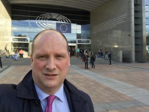 Emmett Devereux pauses for a picture in front of the European Union Parliament in Brussels.